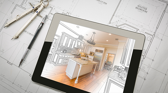 Architekturzeichnung einer Küche auf einem Tablet, daneben Bauplan, Zirkel und Kugelschreiber.