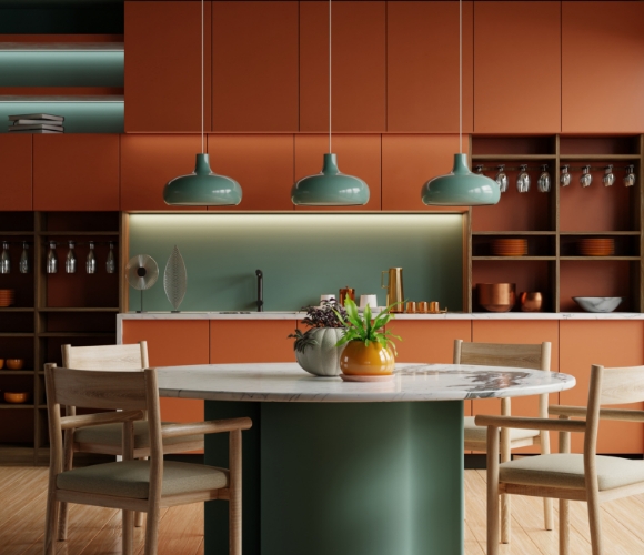 Farbenfrohe Wohnk&uuml;che mit Terracotta-Fronten und gr&uuml;nen Akzenten, Designleuchten und rundem Esstisch
