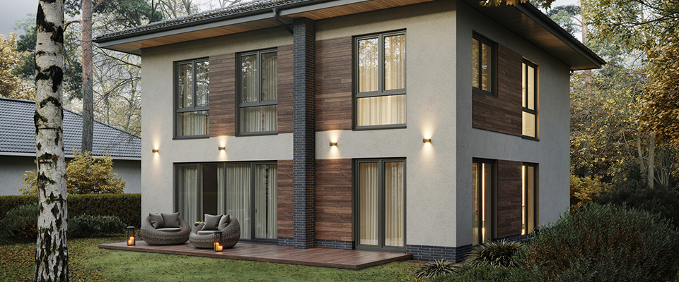 Modernes zweistöckiges Einfamilienhaus mit Holz- und Putzfassade, großen Fenstern, moderner Außenbeleuchtung und Terrasse im Gartenbereich.